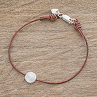 Fine silver pendant bracelet, 'Magic Planet in Brown' - Fine Silver Pendant Bracelet with Brown Leather Cord