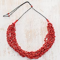 Ceramic beaded torsade necklace, 'Bundled Joy in Red' - Red Ceramic Beaded Pendant on Black Adjustable Cord Necklace
