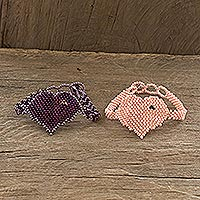 Beaded friendship bracelets, 'Two Hearts in Grape and Peach' (pair) - Purple and Peach Beaded Heart Friendship Bracelets (Pair)