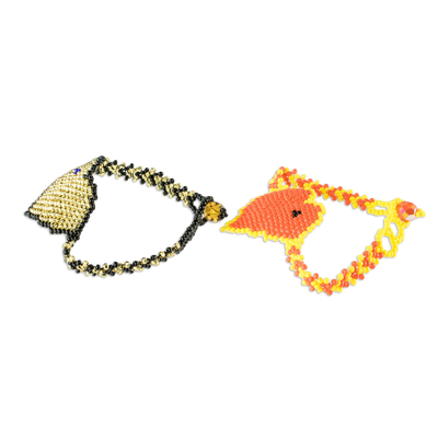 Beaded pendant friendship bracelets, 'Two Hearts in Gold and Flame' (pair) - Hand Crafted Heart Pendant Friendship Bracelets (Pair)