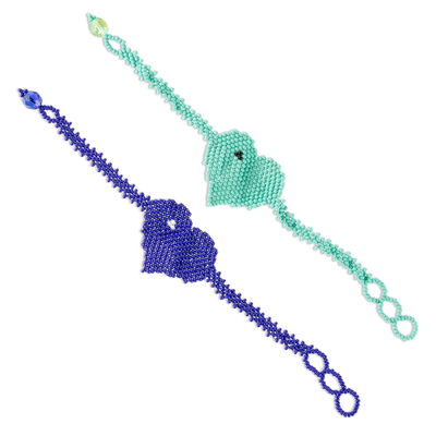 Beaded pendant friendship bracelets, 'Two Hearts in Aqua and Royal' (pair) - Blue and Aqua Glass Beaded Friendship Bracelets (Pair)