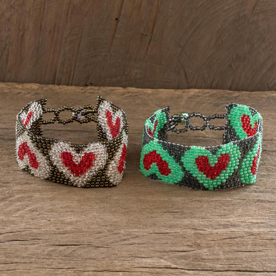 Beaded wristband friendship bracelets, 'Hearts and More Hearts' (pair) - Adjustable Beaded Heart Motif Friendship Bracelets (Pair)