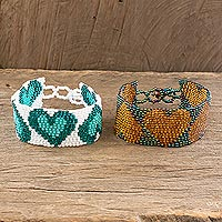 Beaded wristband friendship bracelets, 'Hearts in Gold and Green' (pair)