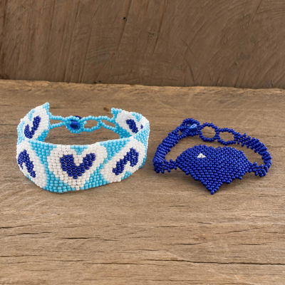 Beaded wristband friendship bracelets, 'Hearts in Royal' (pair) - Blue Heart Motif Beaded Friendship Bracelets (Pair)
