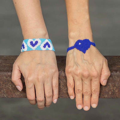 Beaded wristband friendship bracelets, 'Hearts in Royal' (pair) - Blue Heart Motif Beaded Friendship Bracelets (Pair)