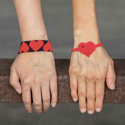 Beaded wristband friendship bracelets, 'Hearts in Red' (pair) - Red Heart Themed Beaded Friendship Bracelets (Pair)