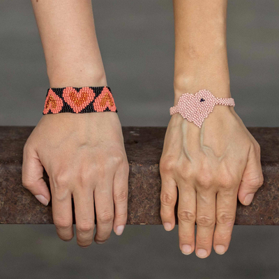 Beaded wristband friendship bracelets, 'Hearts in Melon and Peach' (pair) - Heart Motif Friendship Bracelets in Melon and Peach (Pair)