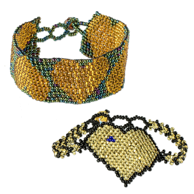 Beaded wristband friendship bracelets, 'Hearts in Gold' (pair) - Hand Crafted Beaded Heart Motif Friendship Bracelets (Pair)