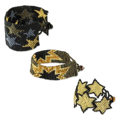 Beaded wristband friendship bracelets, 'Stars in Gold' (set of 3) - Black and Gold Beaded Star Friendship Bracelets (Set of 3)