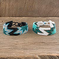 Beaded wristband friendship bracelets, 'Twin Stars in Teal' (pair) - Artisan Crafted Beaded Star Friendship Bracelets (Pair)