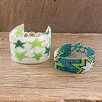 Beaded wristband friendship bracelets, 'Stars in Lime' (pair) - Star Themed Glass Bead Friendship Bracelets (Pair)