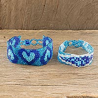 Beaded wristband friendship bracelets, 'Heart and Banner in Blue' (pair)