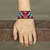 Beaded wristband bracelet, 'Tiger Eyes' - Multicolored Beaded Tiger Motif Bracelet