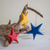 Wood ornaments, 'Primary Stars' (set of 3) - Hand Painted Wood Star Ornaments (Set of 3) (image 2) thumbail