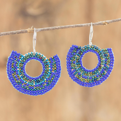 Glass beaded dangle earrings, 'Blue Half Moon' - Hand Beaded Blue Circular Dangle Earrings from Costa Rica
