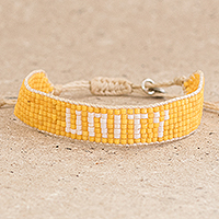 Glass beaded bracelet, 'Unity in Yellow' - Yellow and White Glass Bead Bracelet Saying Unity