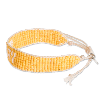 Armband aus Glasperlen - Gelbes und weißes Glasperlenarmband mit dem Spruch „Einheit“.
