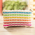Recycled plastic fiber cosmetic bag, 'Revived Rainbow' - Rainbow Colored Cosmetic Clutch Made with Recycled Plastic thumbail