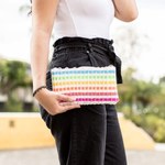 Handwoven cosmetic bag, 'Revived Rainbow' - Handwoven Rainbow Colored Cosmetic Clutch Made
