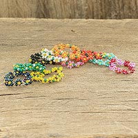 Glass beaded friendship rings, 'Floral Forever' (set of 10) - Multicolored Glass Beaded Rings from Guatemala (Set of 10)