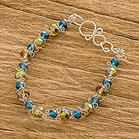 Crystal beaded bracelet, 'Iridescent Blue and Honey' - Blue and Amber Crystal Beaded Bracelet from Costa Rica