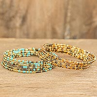 Beaded wrap bracelets, 'Sea and Sand' (pair) - Blue and Gold Glass Beaded Wire Wrap Bracelets (Pair)