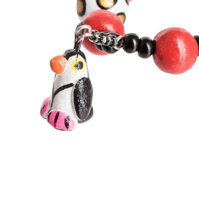 Ceramic beaded stretch bracelet, 'Dangling Penguins' - Handcrafted Ceramic Beaded Stretch Bracelet with Penguins