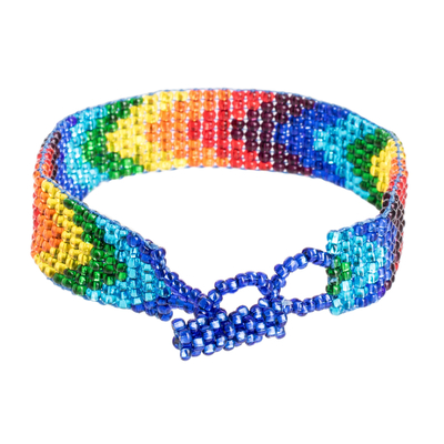Beaded wristband bracelet, 'Happiness and colour' - Handcrafted Rainbow Beaded Wristband Bracelet