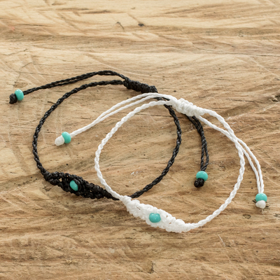 Beaded macrame bracelets, 'Art of Knots in Onyx and White' (pair) - Handcrafted Beaded Macrame Cord Bracelets (Pair)