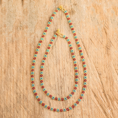 Perlenketten, (Paar) - Paar Glasperlenketten mit Blumenmotiv aus Guatemala