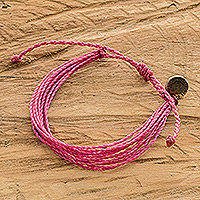 Handcrafted cord wristband bracelet, 'Pink Bougainvillea' - Pink Cord Wristband Bracelet with Strands and Metallic Charm