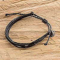 Handcrafted cord wristband bracelet, 'Charcoal' - Unisex Black Cord Wristband Bracelet with Strands and Charm