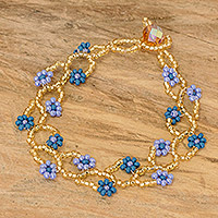 Glass beaded wristband bracelet, 'Blue Floral Hugs' - Floral Glass Beaded Wristband Bracelet Crafted in Guatemala