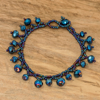 Glass beaded charm bracelet, 'Lights of the Depths' - Glass and Crystal Beaded Charm Bracelet in Blue Tones