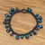 Glass beaded charm bracelet, 'Lights of the Depths' - Glass and Crystal Beaded Charm Bracelet in Blue Tones thumbail