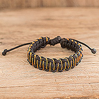 Handcrafted braided bracelet, 'Orange Adventure' - Handcrafted Braided Bracelet with Sinuous Orange Accents