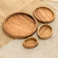 Wood snack plates, 'Delicacy Family' (set of 4) - Set of 4 Hand-Carved Conacaste Wood Snack Plates