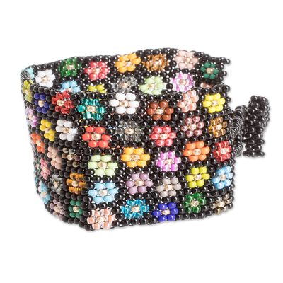 Glass beaded wristband bracelet, 'Dark Blossoming Harmony' - Handcrafted Floral Glass Beaded Wristband Bracelet in Black