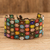 Glass beaded wristband bracelet, 'Bronze Blossoming Harmony' - Handcrafted Floral Glass Beaded Wristband Bracelet in Bronze (image 2) thumbail