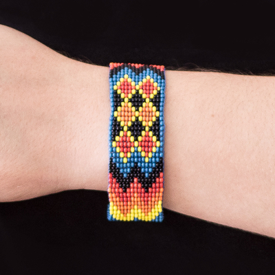 Glass beaded wristband bracelet, 'Geometric Lineage' - Handmade Geometric Vibrant Glass Beaded Wristband Bracelet