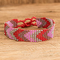 Glass beaded wristband bracelet, 'Berry Directions' - Handcrafted Geometric Pink Glass Beaded Wristband Bracelet