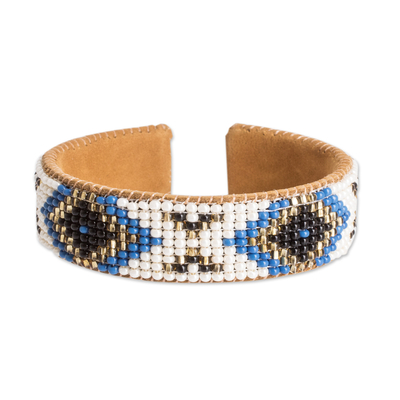 Leather-accented glass beaded cuff bracelet, 'Deity Diamonds' - Ivory and Blue Glass Beaded Cuff Bracelet with Leather