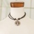 Collar colgante de níquel - Collar con colgante con temática de astrología maya y signo B'atz'