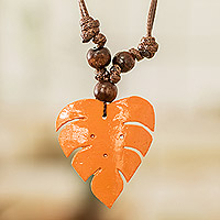 Wood and calabash gourd pendant necklace, 'Jungle Orange' - Leafy Orange Calabash Gourd Pendant Necklace with Wood Beads