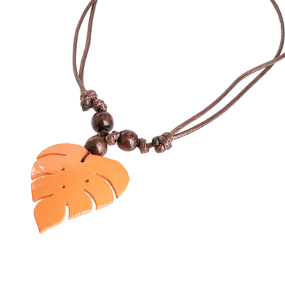 Wood and calabash gourd pendant necklace, 'Jungle Orange' - Leafy Orange Calabash Gourd Pendant Necklace with Wood Beads