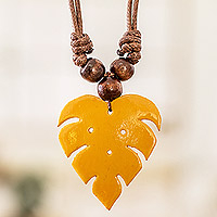 Wood and calabash gourd pendant necklace, 'Jungle Yellow' - Leafy Yellow Calabash Gourd Pendant Necklace with Wood Beads