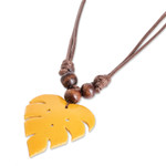 Wood and calabash gourd pendant necklace, 'Jungle Yellow' - Leafy Yellow Calabash Gourd Pendant Necklace with Wood Beads