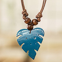 Wood and calabash gourd pendant necklace, 'Jungle Blue' - Leafy Blue Calabash Gourd Pendant Necklace with Wood Beads