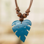 Wood and calabash gourd pendant necklace, 'Jungle Blue' - Leafy Blue Calabash Gourd Pendant Necklace with Wood Beads