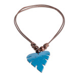 Wood and calabash gourd pendant necklace, 'Jungle Blue' - Leafy Blue Calabash Gourd Pendant Necklace with Wood Beads